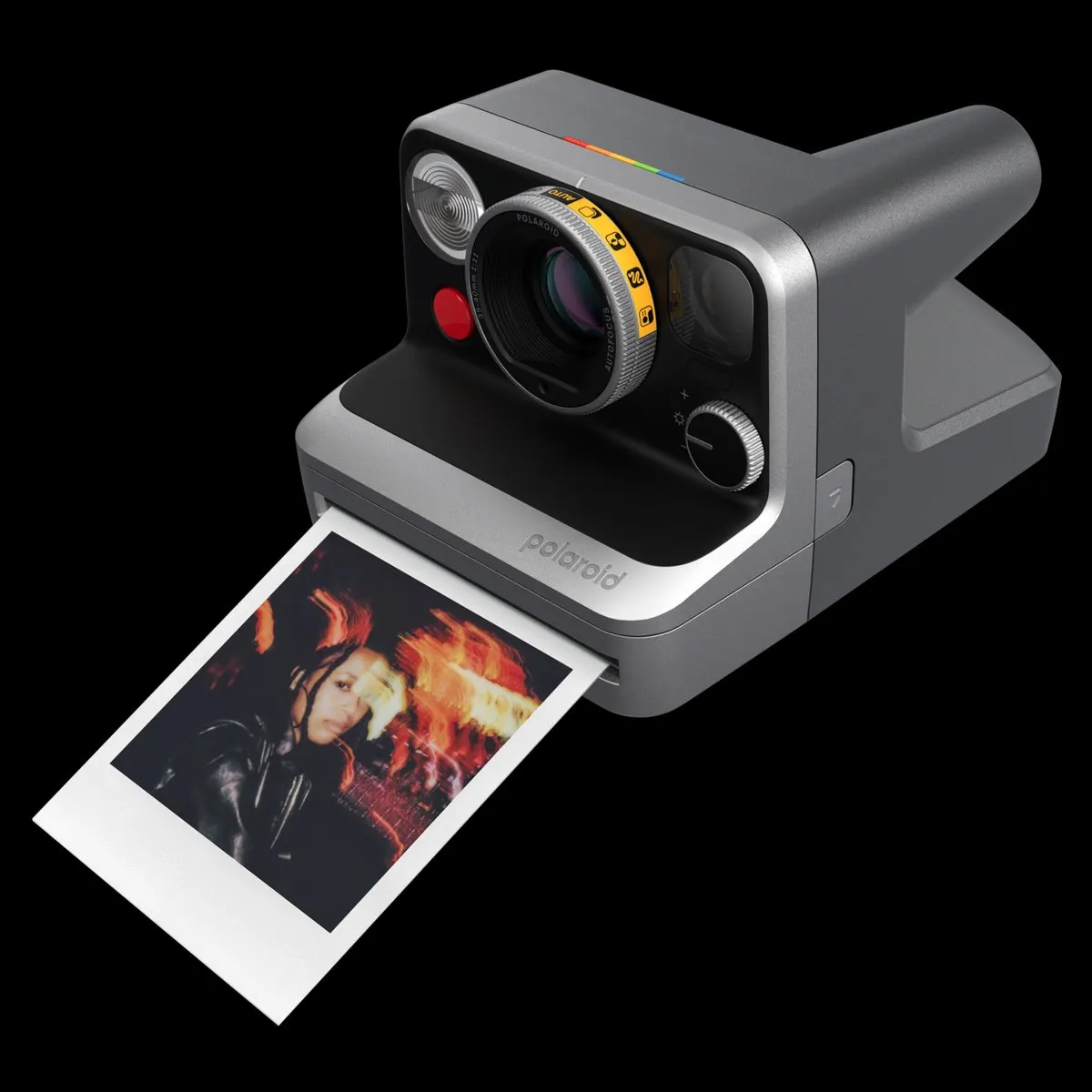 Polaroid Mod printing an instant photo with the mode dial visible on the lens